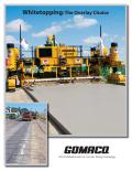 A GOMACO GHP-2800 is slipforming the new concrete overlay on top of existing asphalt.